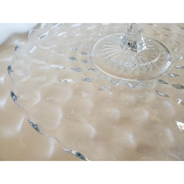 Pretty vintage cut glass serving tray with fluted edges and keyhole carrying handle. Petite and elegant, the unique design...