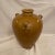 Lovely ocher glazed stoneware pottery vase with three applied looped handles with Foliate decoration.