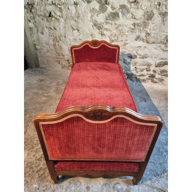 This antique French daybed dates from the late 19th to early 20th century. The frame is made of solid beechwood with...