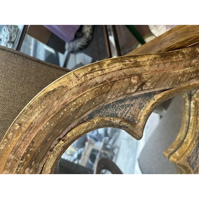 baroque mirror in carved wood, presumably French. mirror put back again