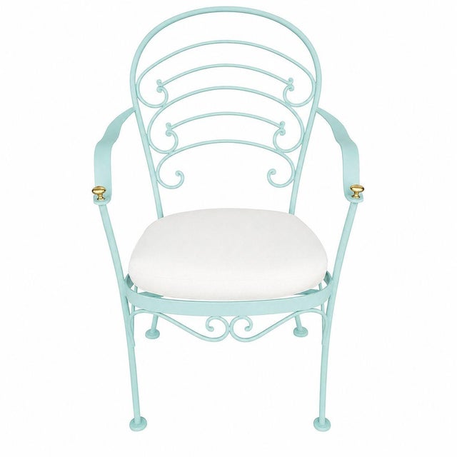A set of two rod iron "Ribcage" outdoor/patio featuring one armchair and one side chair. This chair is constructed with...