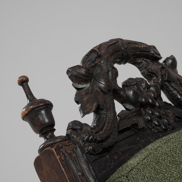 This 1900s French wooden folding armchair blends decorative craftsmanship with practical ingenuity, offering a refined...