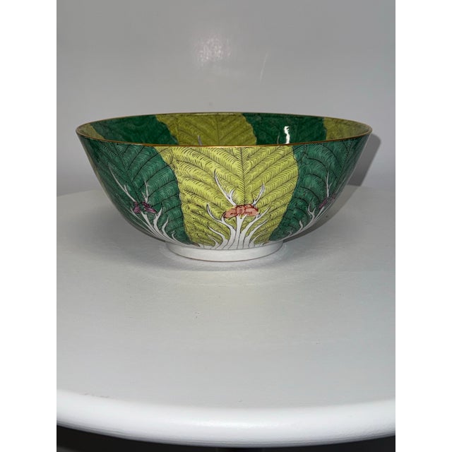 This is a vintage Famille Verte Chinese porcelain bowl featuring a bok choy cabbage leaf design with a brass rim. Based on...