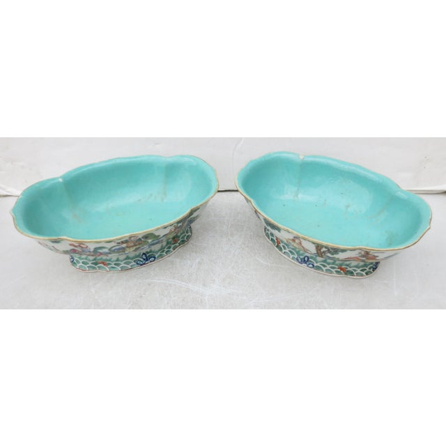 Matching pair of quatrefoil offering bowls. Rose Medallion enamels with six-character marks of the Qing dynasty. The...