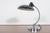 This kaiser idell 6631r luxus desk lamp was designed by german designer christian dell in 1936. The model is one of the...