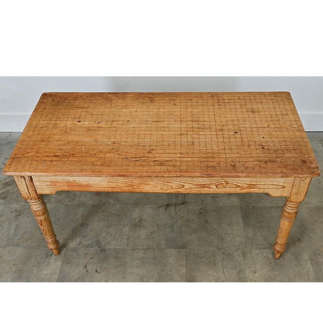 An English pine coffee table with a unique top and stunning woodgrain throughout. The top is made from a single plank of...