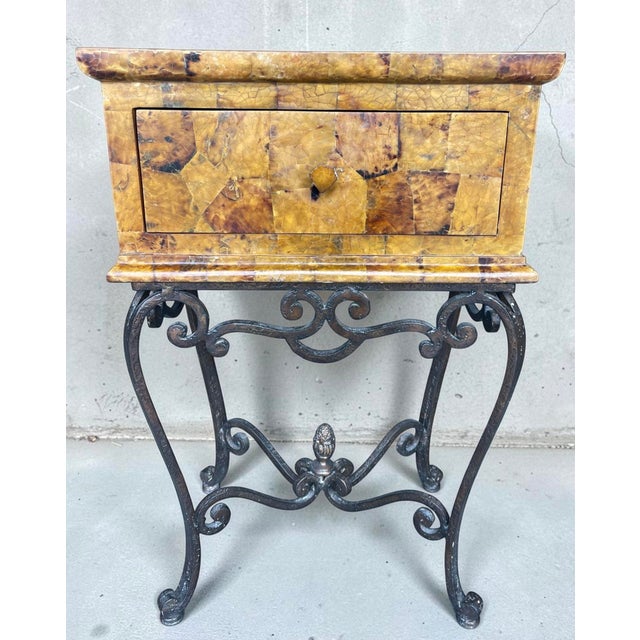 Vintage tessellated horn veneer box on wrought iron stand in the Hollywood Regency style. Features warm amber-toned horn...
