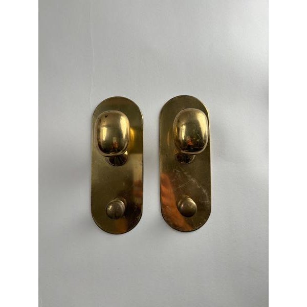 Rare lot of "Super" model brass coat hangers designed by the famous designer and architect Luigi Caccia Dominioni for...