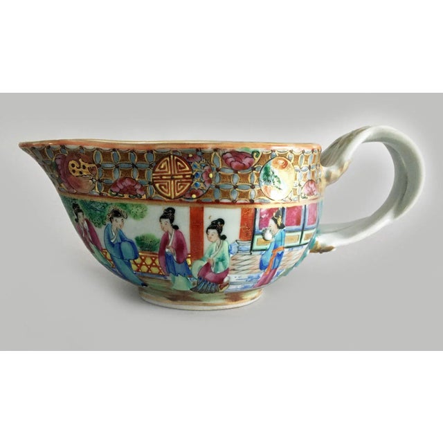 Chinese Export antique Rose Mandarin porcelain gravy or sauce boat decorated with a continuous palace scene of five ladies...