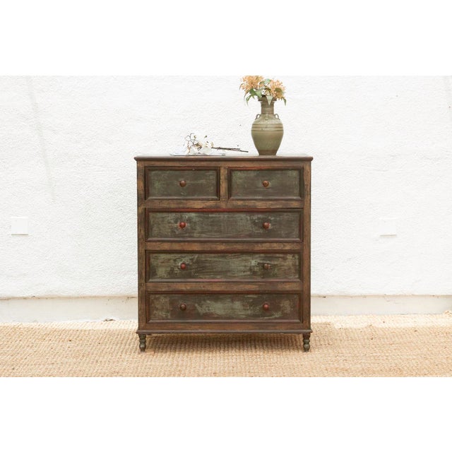 Invite a piece of authentic character and practical charm into your home with this delightful vintage painted chest of...