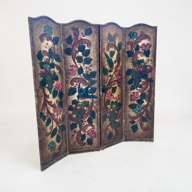 A late 19th‑century French hand painted four‑fold leather dressing screen. Also ideal as a room divider or privacy screen....