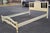 A Mid Century French Provincial Style Cream Painted and Partial Gilt Full Size Bedframe. Metal side rails. Measures 56.75"...
