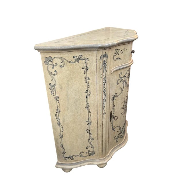 Beautiful French Provincial Bombe Chest featuring an Antiqued Cream finish. Its signature serpentine curves and distressed...