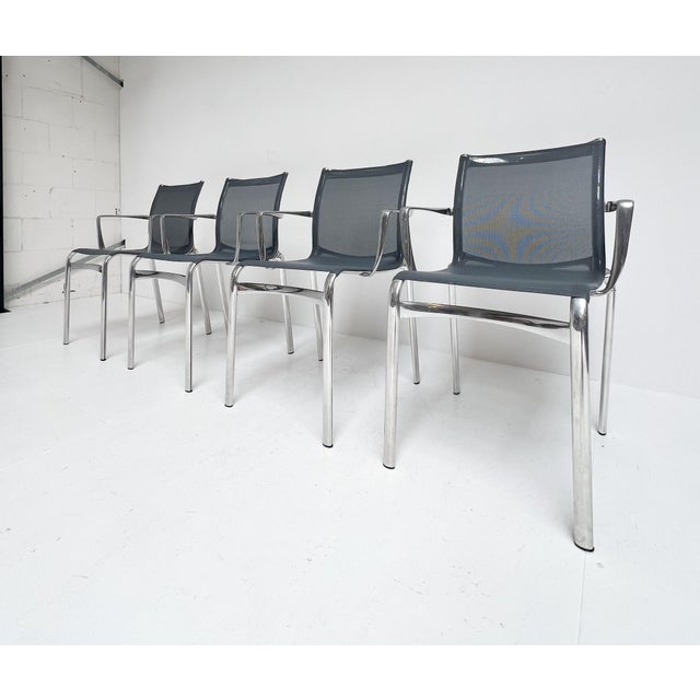 A magnificent set of 4 silver-colored aluminum chairs by alberto meda. A design called the “big frame 44,” produced by the...
