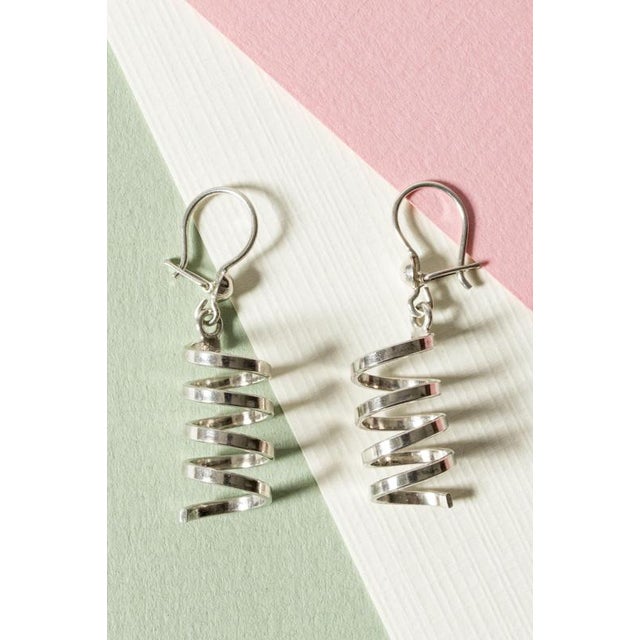 Pair of beautiful silver earrings by Cecilia Johansson, in a vivacious, bouncy spiral design.