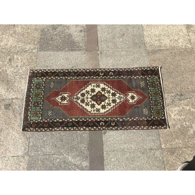 This is a vintage Turkish Oushak rug from the 1960s. The piece was hand-knotted.