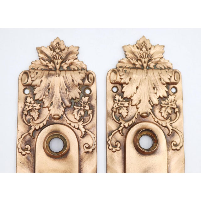 Italian Renaissance style door back plates made of polished brass with double keyholes. Made by Russell & Erwin in the...