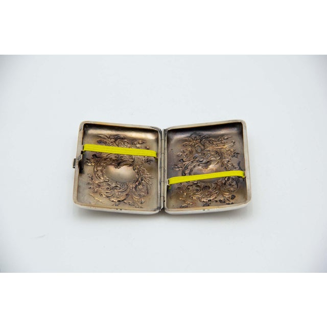 Rectangular Silver Cigarette Case with Relief, in Very Good conditions. Designed 1890 to 1919 This piece has an...