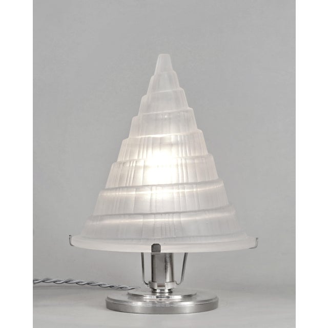 SABINO A rare French 1935 art deco table lamp in nickel plated brass holding a large shade in frosted and locally hand...
