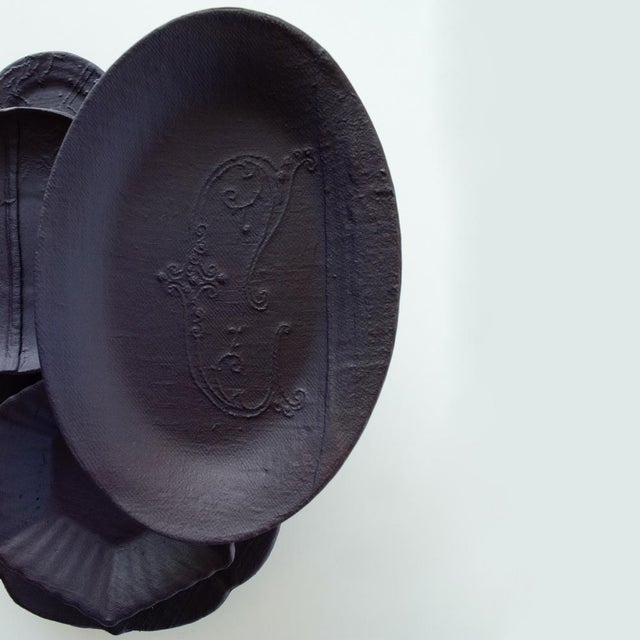 This installation consists of a group of hand made plates in porcelain with our signature fabric texture combined with...