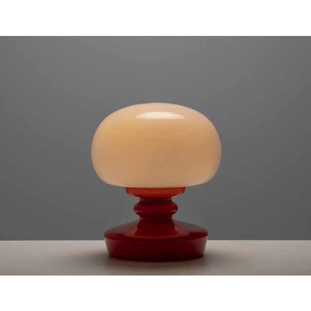 This all-glass table lamp was produced in the 1970s by opp jihlava and designed by štěpán tabera, a noted figure of...