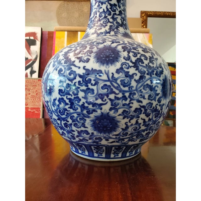 A large vintage Chinese porcelain ming style vase . Having intricate underglaze blue decorations with smooth while...