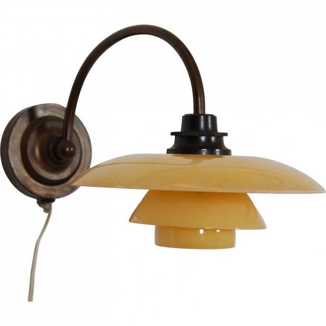 Poul henningsen wall lamp model ph-1/1 with yellow shades. The lamp is from the 1930s and appears in great condition with...