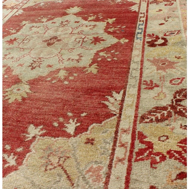 Mid 20th Century Mid 20th Century Red Field Vintage Turkish Oushak Rug With Geometric Medallion and Floral Motifs For Sale - Image 5 of 7