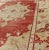 Mid 20th Century Mid 20th Century Red Field Vintage Turkish Oushak Rug With Geometric Medallion and Floral Motifs For Sale - Image 5 of 7