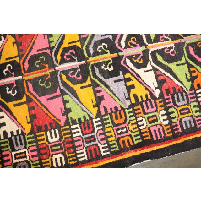 a mid 20th century Quirky Tibetan Scatter Size Rug