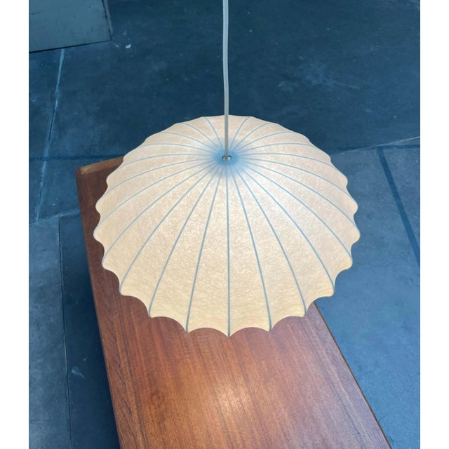 Mid-century Cocoon pendant light by Goldkant Leuchten, based on a design by Friedel Wauer from the 1960s. A minimalist...