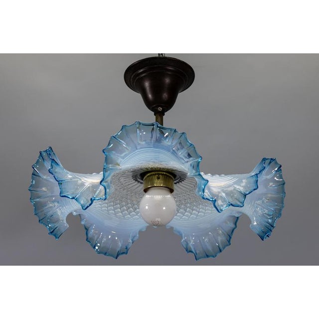 French Art Deco ceiling light with blue opalescent glass, circa 1930s. Elegant ceiling light featuring a blue and white...