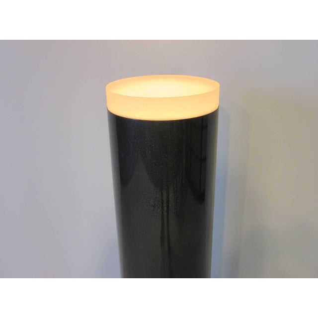 A light up Lucite pedestal in a dark gray with detailed finish having a frosted round top , on and off foot switch to the...