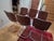 Set of six Mid-Century Modern Italian dining room chairs in cognac brown leatherette and polished chrome tubular framing.