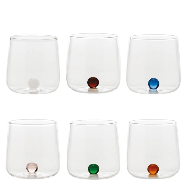 Handmade tumblers and bottles in colored borosilicate glass that is thermal shock safe. The small marbles inside are...