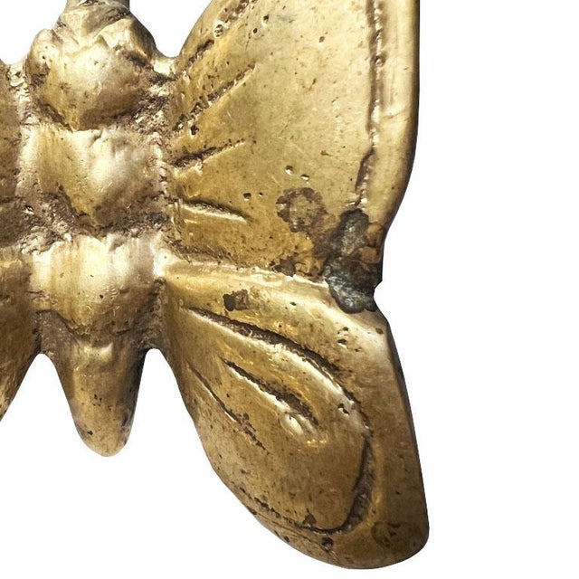 A small brass butterfly motif wall or door hook. It's all in the details, and this pretty brass vintage hook is the...