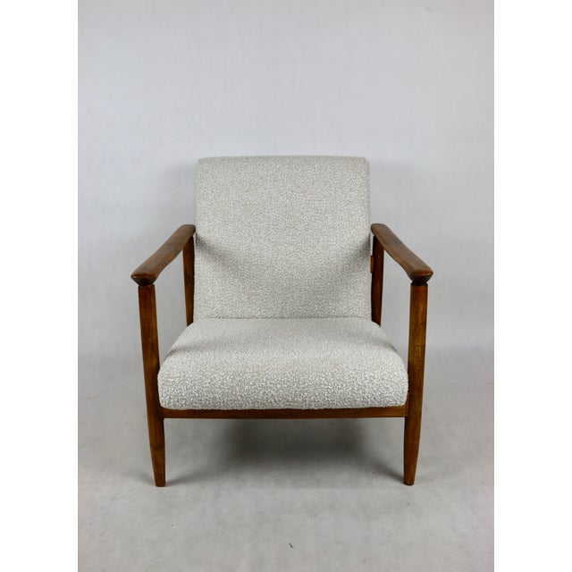 GFM-142 armchair, designed by Edmund Homa in the 1970s, upholstered in white ivory boucle fabric. 2 pieces available. The...
