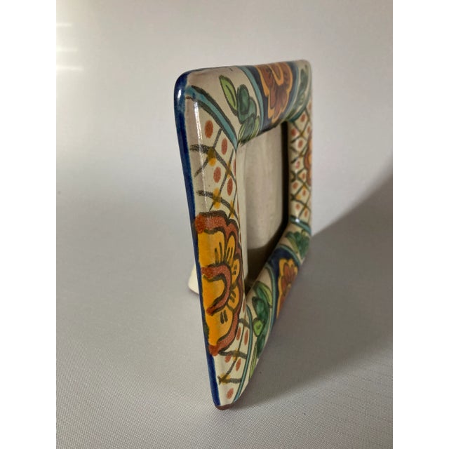 Contemporary Artis signed blue, yellow, green and orange mix colors floral design ceramic picture frame , believe from...