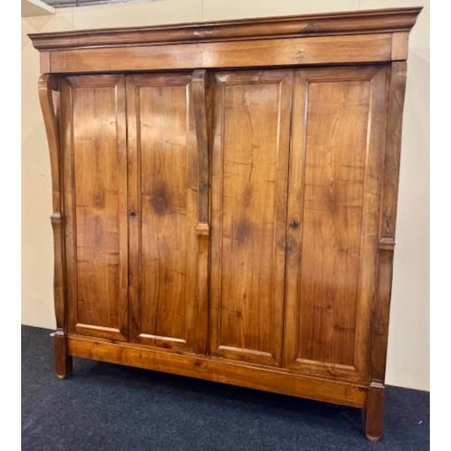 Four-door pantry cabinet from the first half of the 19th century in solid walnut wood. Front outlined by tie pilasters,...