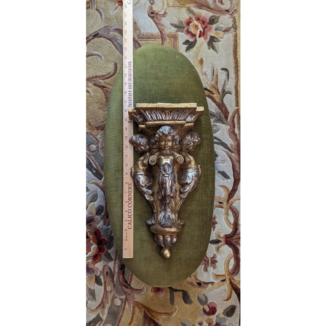Vintage gilded-style finish corbel depicting three cherubs. Pre-owned but never used; original sales tags attached....