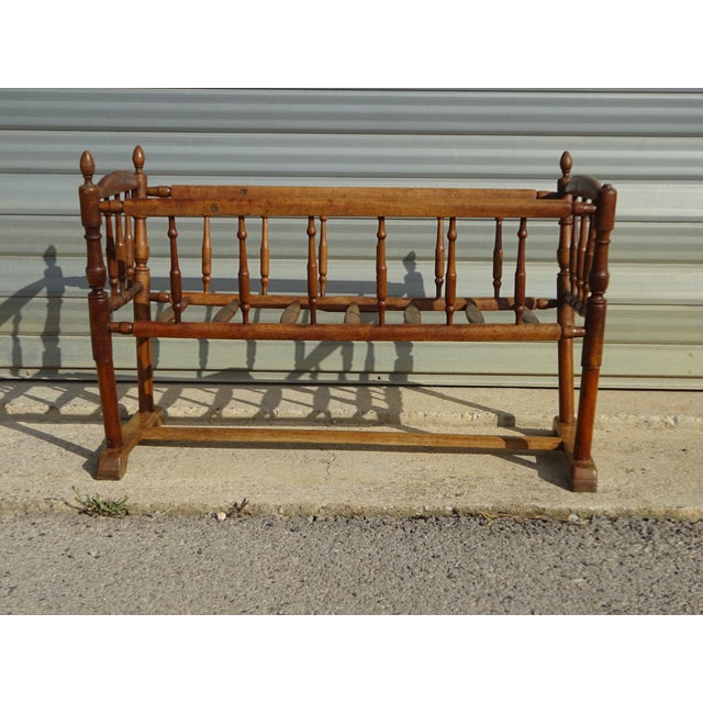 Cradle or small crib with bars, made entirely of solid walnut. The frame is composed of 18 turned wooden bars. 7 bars form...