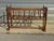 Cradle or small crib with bars, made entirely of solid walnut. The frame is composed of 18 turned wooden bars. 7 bars form...