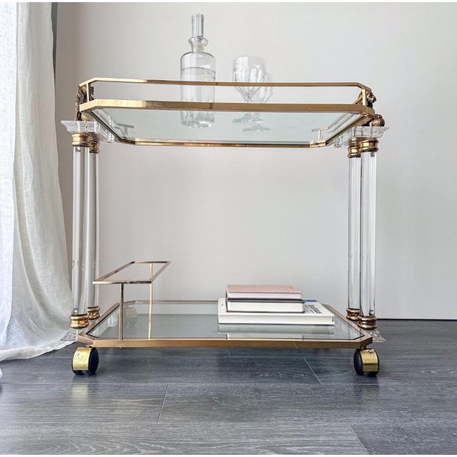Vintage serving/bar cart in the style of the Italian Hollywood Regency of the 1970s–1980s, featuring decorative Medici...