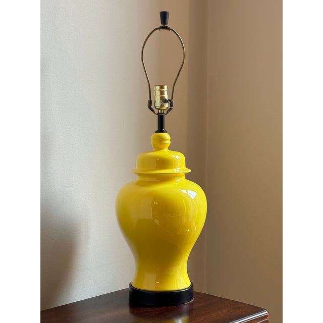 Offering a beautiful circa 1960 Citron yellow ginger jar table lamp with black metal base. If you are looking for a bright...