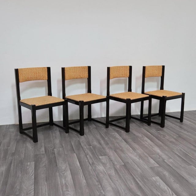 Elegant dining set consisting of 4 chairs with an entirely wooden frame and a sculpted design, seat and backrest...