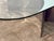 Sculptural Italian coffee table from the 1970s by Giuseppe Raimondi Mod. 3102, featuring a thick oval glass top supported...