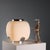 This Italian-made table lamp, reminiscent of Stilnovo products, features an opal glass diffuser and a chromed metal frame....