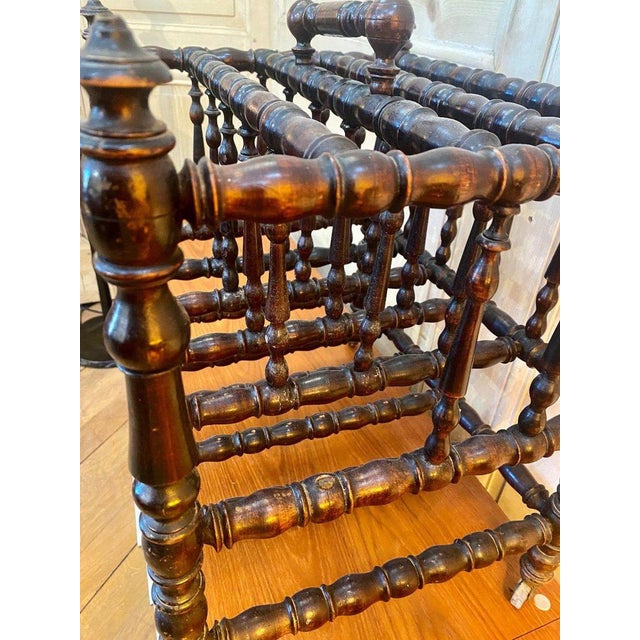 "newspaper holder n iii" newspaper holder niii in turned and blackened wood, missing a bar, handle in the center for...