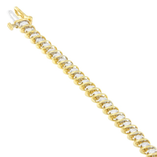 Bold meets brilliant! This unique bracelet is crafted with classic round cut diamonds nestled between raised bands of high...