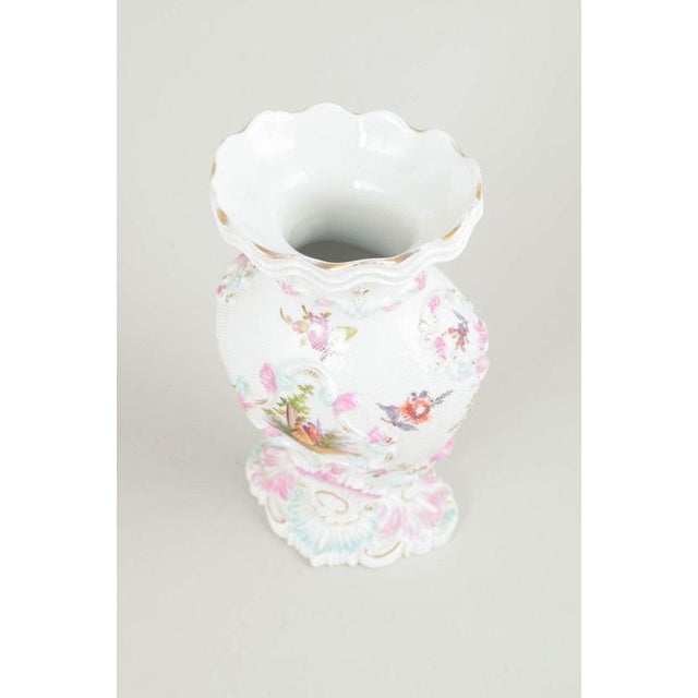 Meissen vase, early 19th century. Rare porcelain vase with rich relief modelling and hand-painted polychrome floral and...
